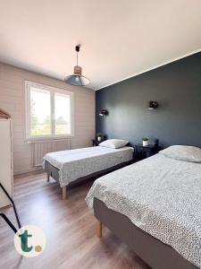 Maisons de vacances Tranquiloue - Maison Cosy a 15min du PuyduFou : photos des chambres