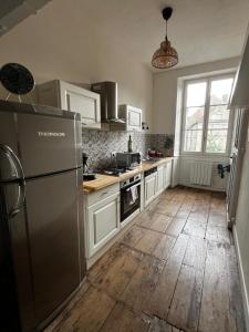 Appartements La Villa Louana charme de l'ancien en coeur de ville : photos des chambres