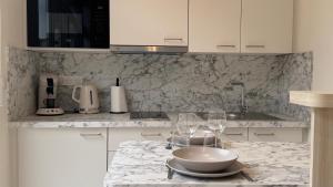 Appartements Au Petit Bonheur - Studio - Centre ville : photos des chambres