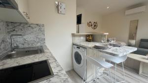 Appartements Au Petit Bonheur - Studio - Centre ville : photos des chambres