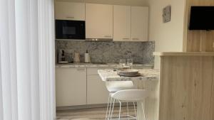 Appartements Au Petit Bonheur - Studio - Centre ville : photos des chambres