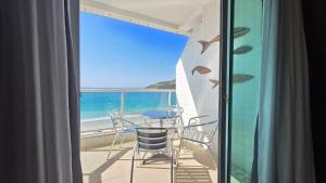 Lindo apartamento frente mar na Prainha com Ar Condicionado, Piscina