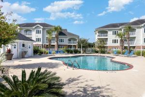 Beautiful 1500 s f 3 Bd - 2 Ba condo overlooking stream and golf course