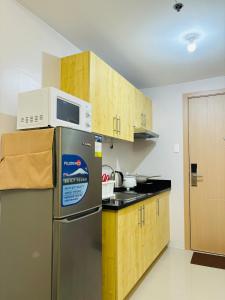 Cozy 1BR Condo at Grass Residences near SM North