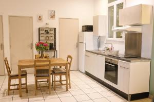 Appartements Maison Cleophee : photos des chambres