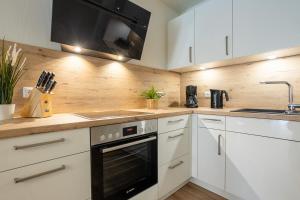 Dorumer Seestern - Ferienwohnung mit Terrasse und Sauna