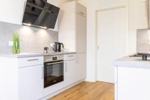 BeltBlick 19 – Exklusive Ferienwohnung mit Garten und Meerblick