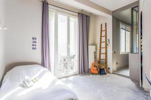 Appartements Appartement chic pres de l-Arc de Triomphe : photos des chambres
