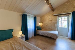 Maisons de vacances La Roche des Bois, maison classee *** (8 pers) : photos des chambres