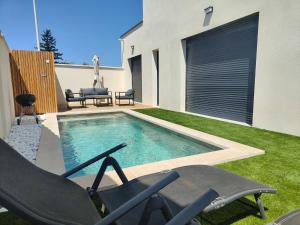 Villas Superbe Maison neuve Piscine Clim parking Recharge voiture electrique : photos des chambres