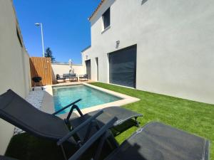 Villas Superbe Maison neuve Piscine Clim parking Recharge voiture electrique : photos des chambres