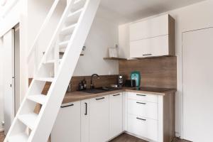 Appartements O ptit moulin- Studio vue sur le port : photos des chambres