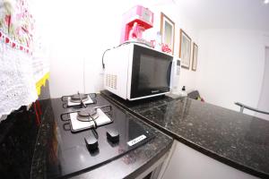 Flat Aconchego BEIRA-MAR térreo quase pé na areia