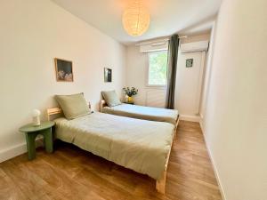 Appartements PGH N51 - Centre, 10 min a la Plage, Garage prive : photos des chambres
