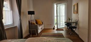 Riva Residence in Old Town Ljubljana by the Cobblers Bridge