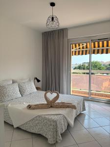 Appartements 3 pieces Antibes, clim, vue mer, piscine et parc : photos des chambres