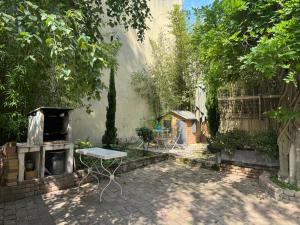 Appartements Cote Jardin - Studio voute by PRIM0 C0NCIERGERIE : photos des chambres