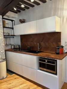 Appartements Coeur de Caen, charme ancien & confort moderne : photos des chambres