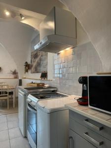 Appartements Cote Cour - Studio voute by PRIM0 C0NCIERGERIE : photos des chambres