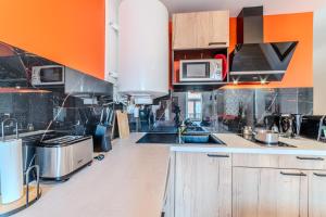 Appartements T2 Dahlia Roanne centre-ville - Parking & Clim : photos des chambres