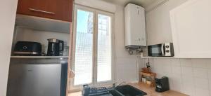 Appartements Proche Clignancourt (Metro 4) et Marche aux Puces : photos des chambres