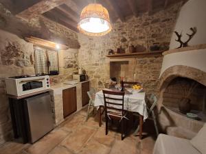 Thelya - Stone House