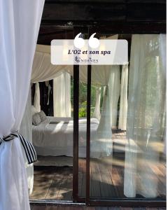 LO2 et son Spa, cabane de verre et de bois