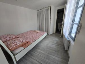 Appartements T2 Cozy proche des Halles Climatise : photos des chambres