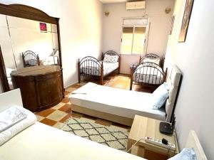 Cozy Host House with 2 air conditioned rooms