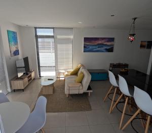 Beachfront Penthouse with patio and free parking