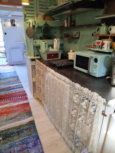Appartements La Salamandre, studio cosy au bord de l-eau : photos des chambres