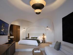 Deluxe Suite with Indoor Hot tub room in Andronis Luxury Suites