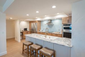 Luxury direct oceanfront corner with a large private balcony, heated pool and garage