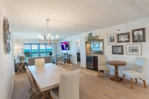 Luxury direct oceanfront corner with a large private balcony, heated pool and garage