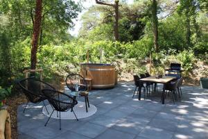 Prachtige 4p wellness Kota in bos met Sauna en Hottub