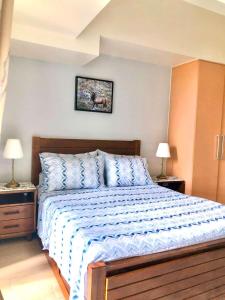 Cosy 1BR Uptown BGC with Balcony and Swimming Pool