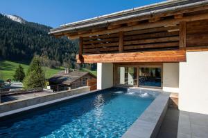 Chalets La Clusaz chalet Anthocyane 14 people, heated pool : photos des chambres