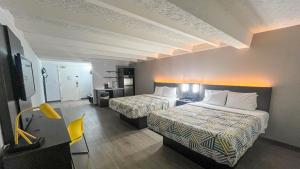 Queen Room with Two Queen Beds - Disability Access - Roll In Shower room in Studio 6 Rockford IL – RFD Airport