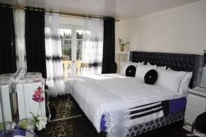 Sejours chez l'habitant Villa confort - Hebergement Touristique Grand PARIS : photos des chambres