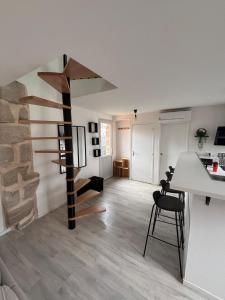 Appartements lesjolislogementsbrivistes Lelegant : photos des chambres