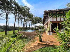 Villas Villa Hau-Oli, 4 chambres, spacieuse, piscine privee, grand jardin fleuri vue golf et 8min a pied de la plage : photos des chambres