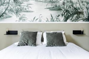 Appartements Oasis Tropicale - Appartement Cosy et Calme a 10 min de la Gare de Roanne : photos des chambres