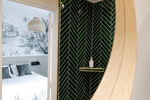 Appartements Oasis Tropicale - Appartement Cosy et Calme a 10 min de la Gare de Roanne : photos des chambres