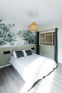 Appartements Oasis Tropicale - Appartement Cosy et Calme a 10 min de la Gare de Roanne : photos des chambres