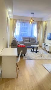 serenity suites apartment with private parking space ,modern equipped gym, swimming pool and a relaxing rooftop with unbeatable city views