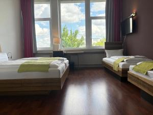 Vierbettzimmer room in AMH Airport-Messe-Hotel Stuttgart