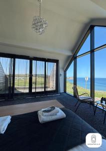 Luxury 4-Bedroom Beachfront Home with Hot Tub & Games Room