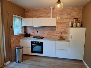 Heerlijk boshuisje Bosnest De Vink met privetuin nabij Veluwepark