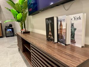 Studio with master bed and 654k screen