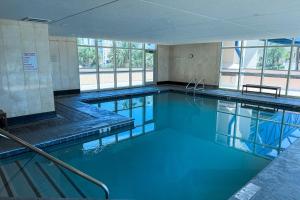 2BR Getaway Close to Beach with Pool and Balcony